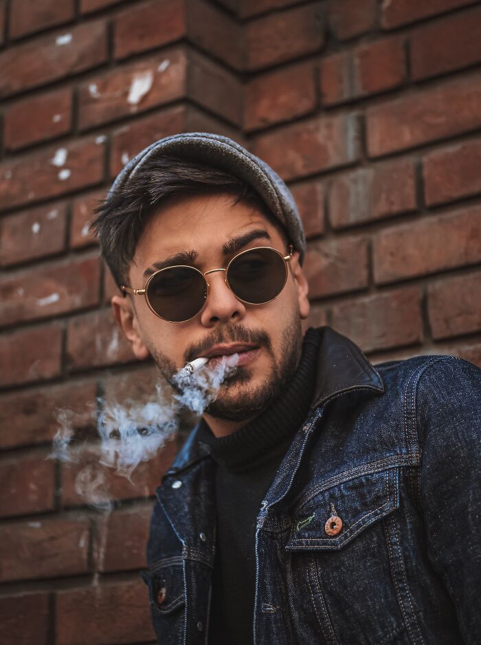 Person sanding and smoking