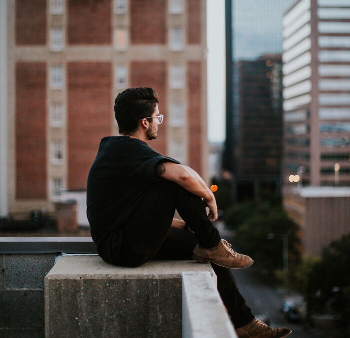 Person sitting and looking