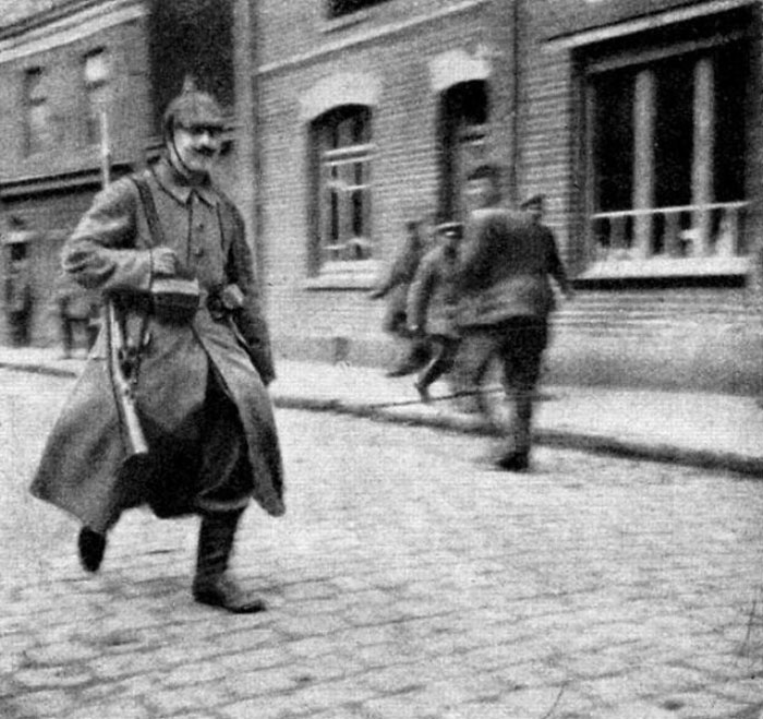 Battalion Courier Adolf Hitler In May 1915, With His Rifle Slung Over His Shoulder, On His Way To Deliver A Message During WWI