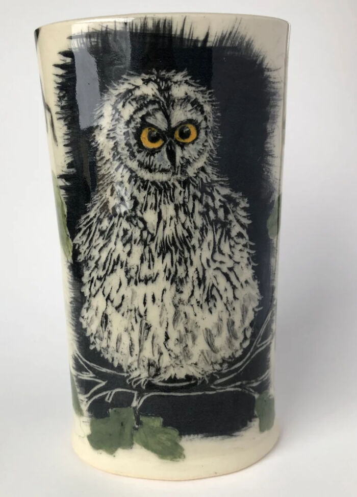 A Bright-Eyed Owl Stares Hungrily, While Down Below, A Squirrel Is On High Alert