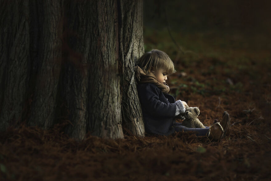 A photograph of a kid sitting in a park