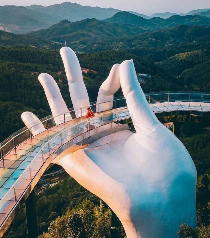 Rainbow Colored Bridge In Giant Hand By Ta Landscape Architecture