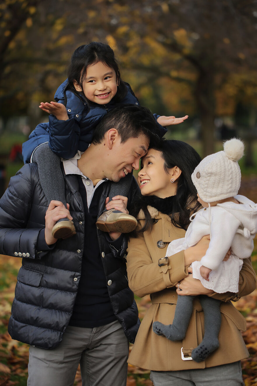 A photograph of a family in a park