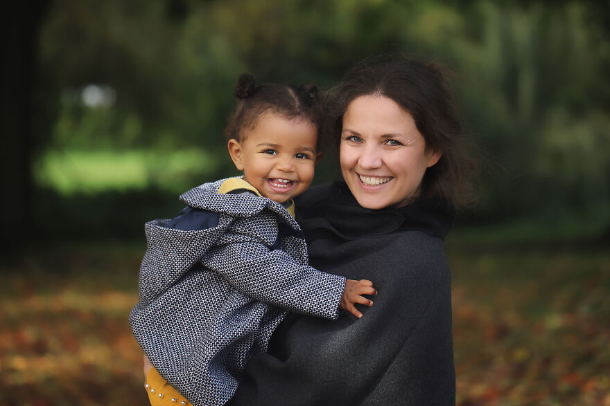A photograph of a mom and a daughter in a park