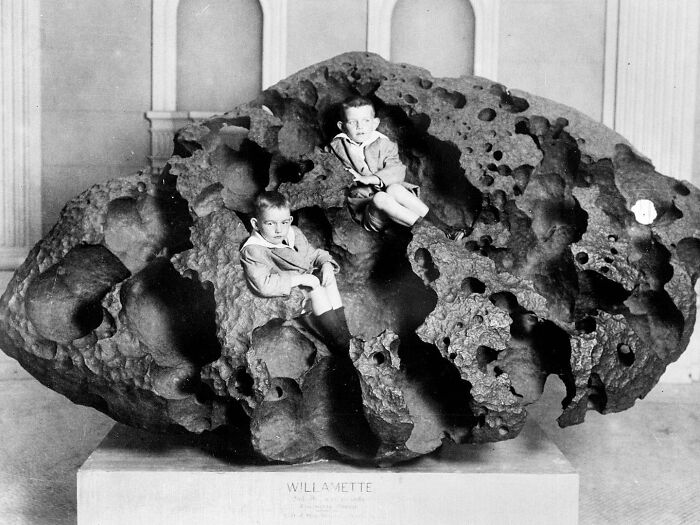 Two Boys Sit Inside Willamette, An Iron Meteorite Weighing 14500 Kg