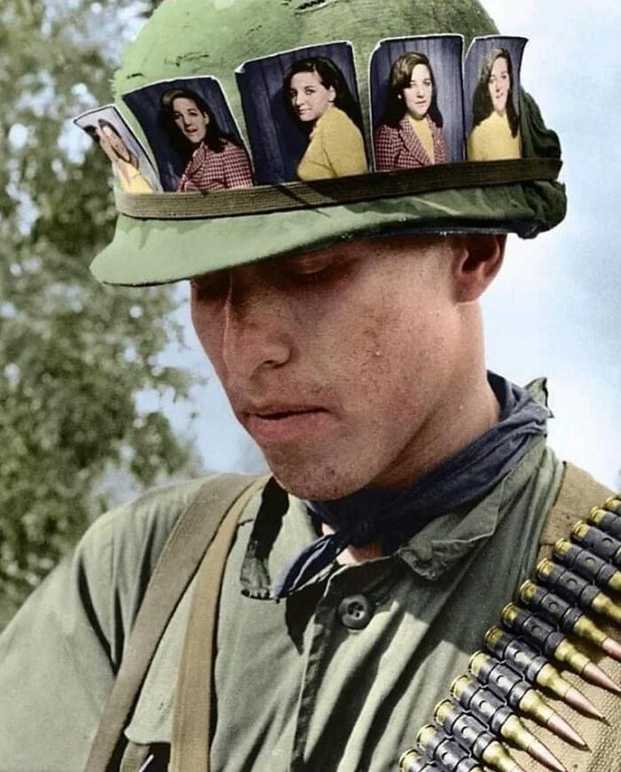 US Soldier With Pictures Of His Girlfriend Attached To His Helmet, Vietnam 1968