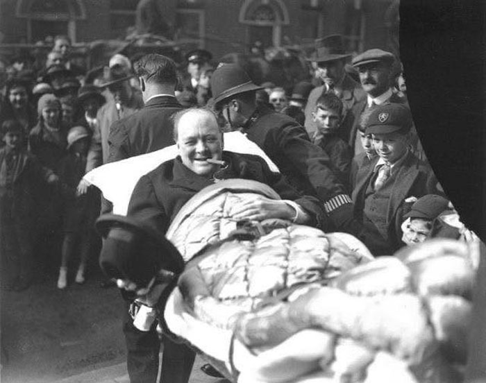 Winston Churchill Is Carried From A Nursing Home Following Being Struck By A Car In New York City, 1931