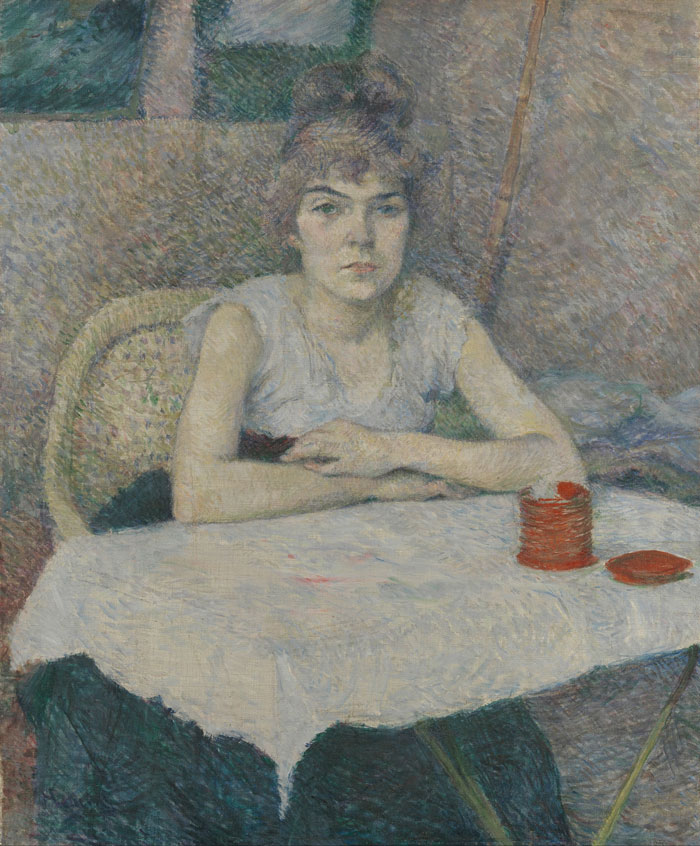 Young Woman At A Table