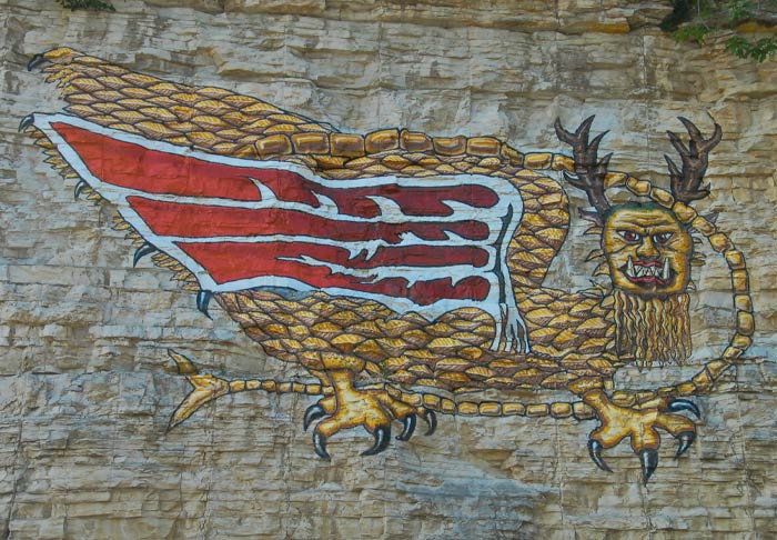 Painting of a Piasa on a rock wall 