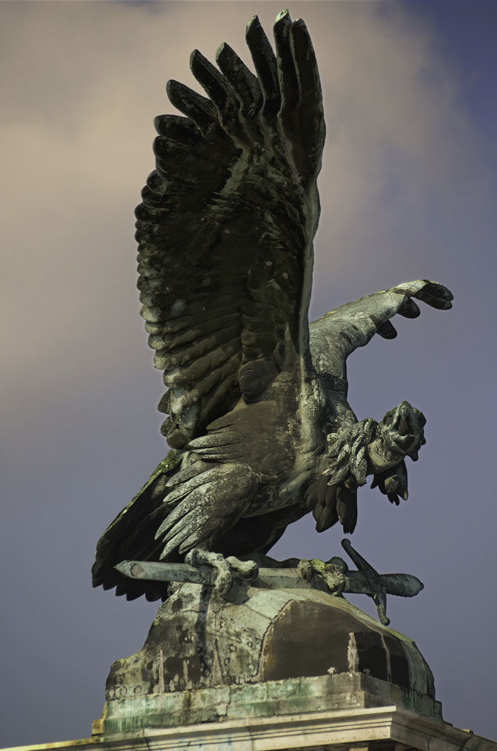 Statue of a Turul bird on a house roof 