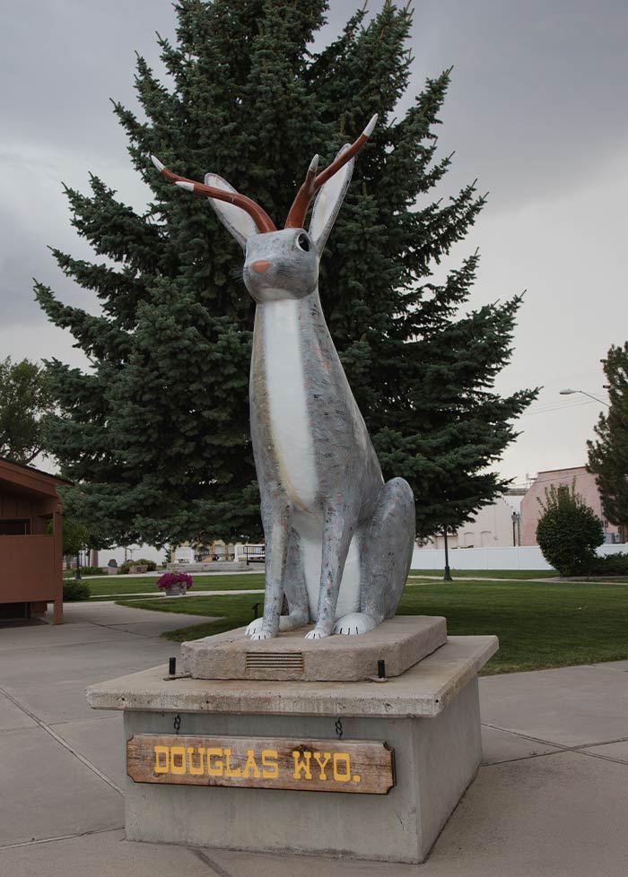Statue of a Jackalope in a park 