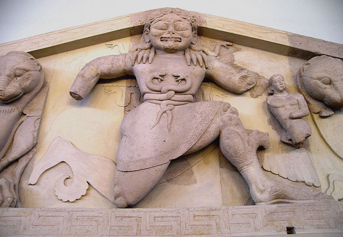 Rock statue of a Gorgon on a building 