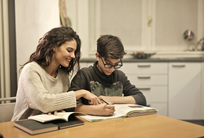 Mom Helping Her Kid With Homework 