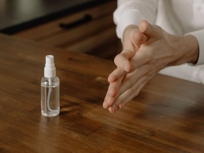 Woman Sanitizes Her Hands 