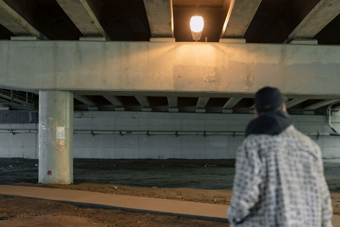 Man Under A Lit Up Bridge 