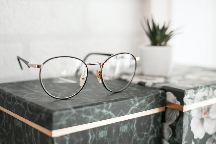 Eyeglasses On A Green Box 