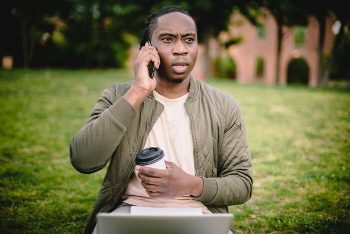 Man Talking On Phone And Drinking Coffee 