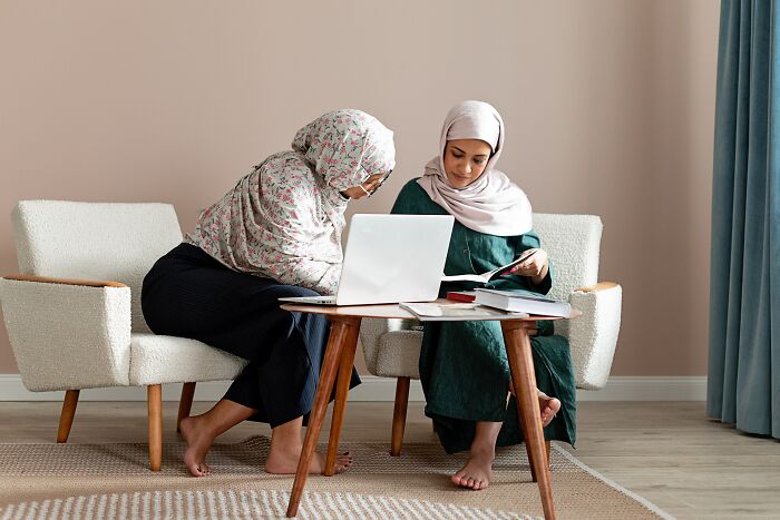 Two Woman Working On Laptop 