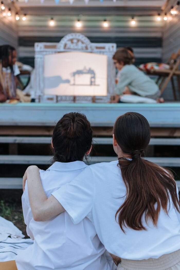 Two Women Watching Kids Play 