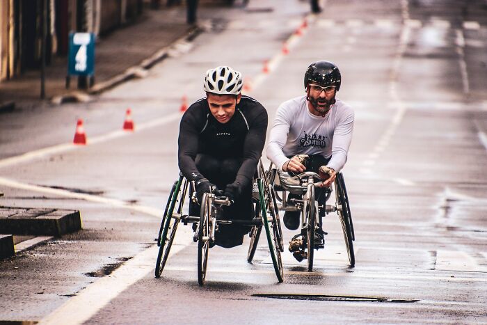 People Cycling In A Three Wheeled Bicycles 