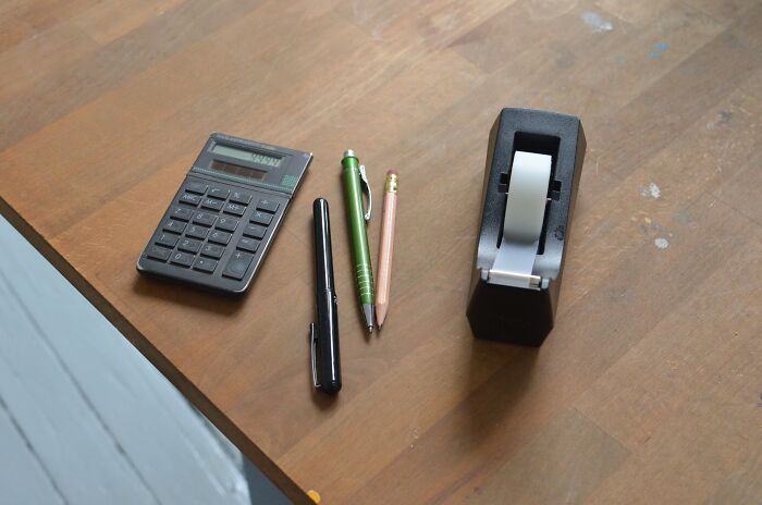 Duck Tape Writing Gear And Calculator On The Table 