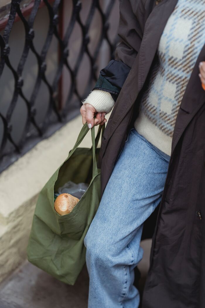 Woman Carrying Grocery Bag Home 