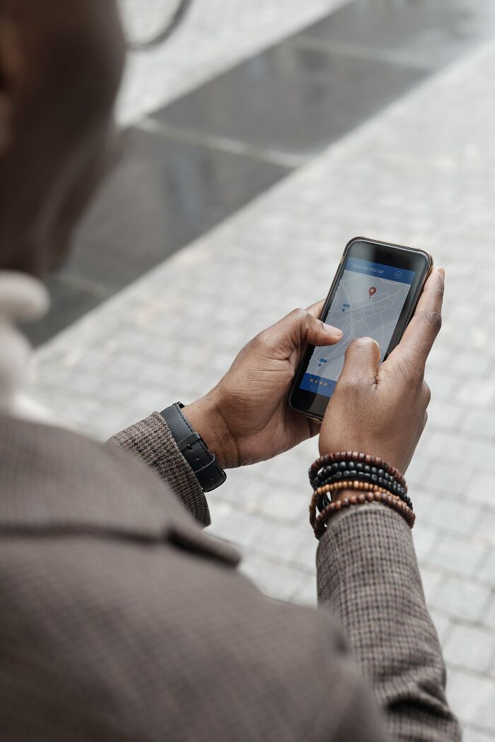 Man Looking For A Place In Maps 