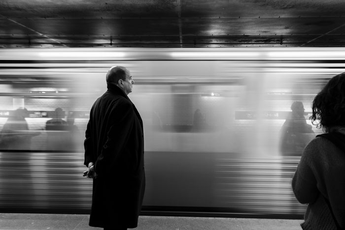 Black and white picture of train and person