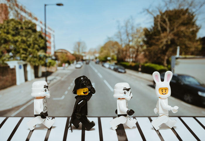 Lego characters walking in the street