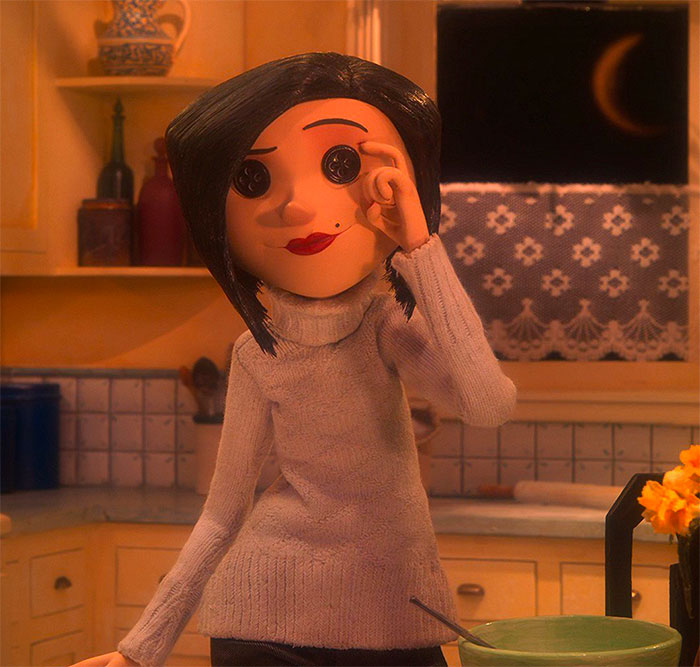 Coraline’s Other Mother standing and smiling from Coraline