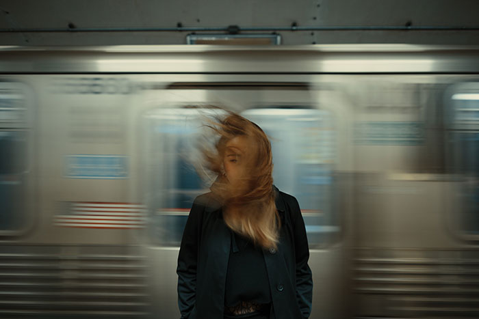 Picture of woman and train motion blur