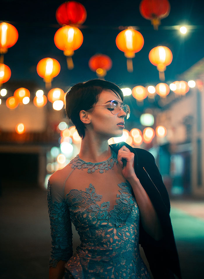 Picture of woman near lanterns