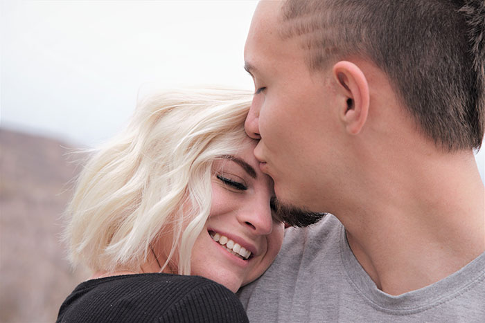 Picture of man kisses woman