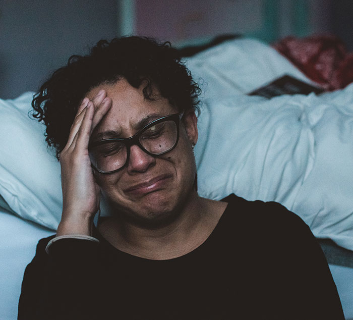Woman sitting and crying