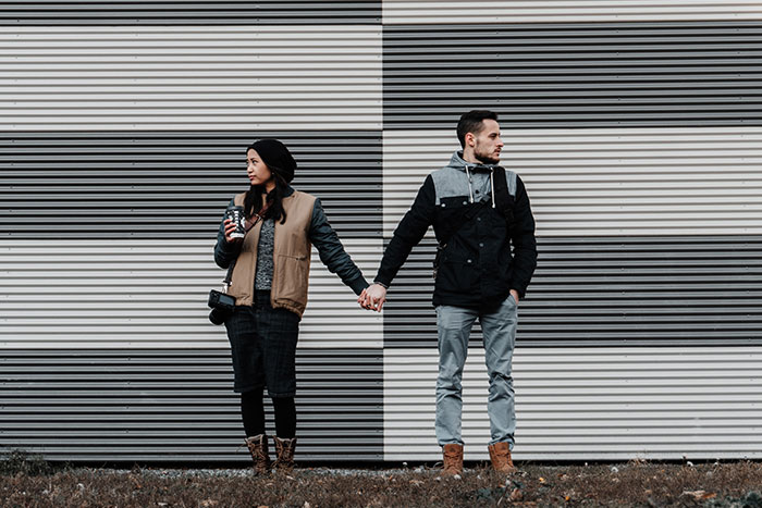 Woman and man holding hands