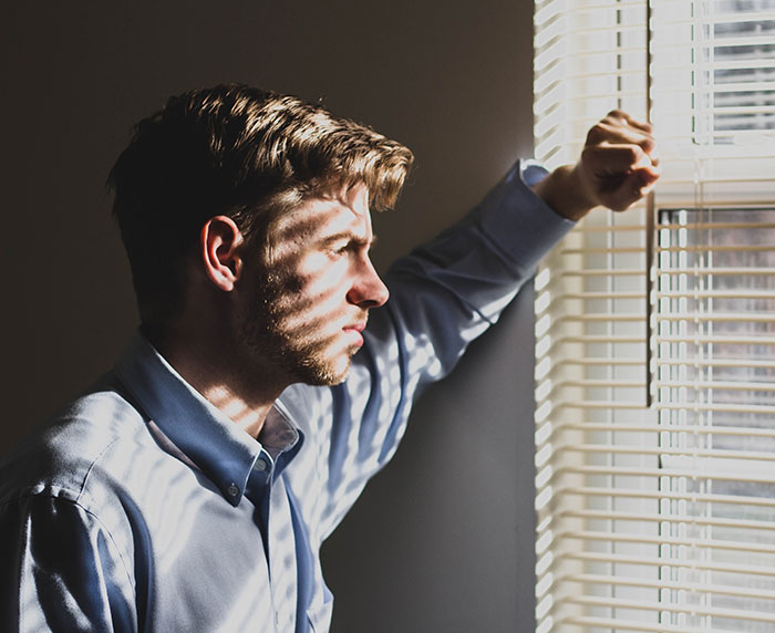 Person looking through the window