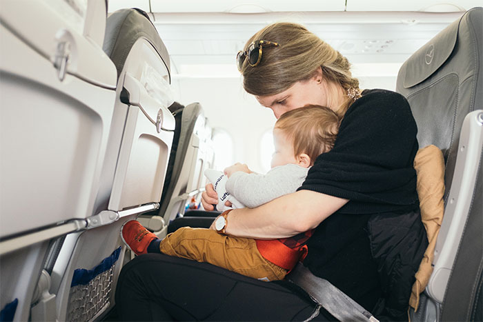 Mother Doesn't Care That Her Kid Is Bothering Other Plane Passengers, Regrets It Later