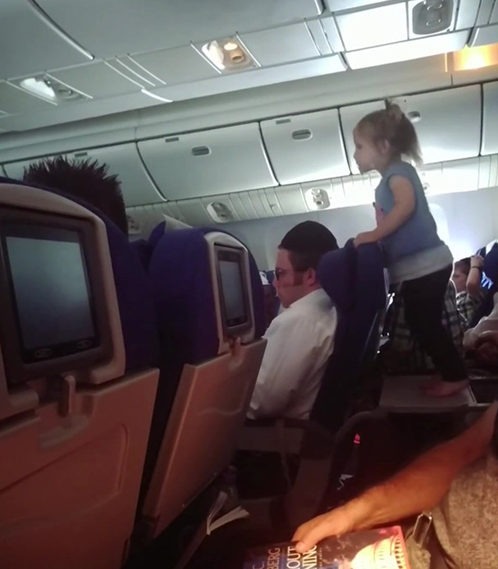 Parents Who Let Their Child Jump All Over Tray Table During An 8-Hour Flight Receive Online Backlash