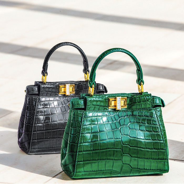 Close-up shot of black and green handbags