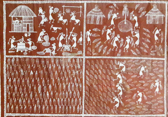 Warli folk painting depicting scenes of human figures engaged in hunting, dancing, sowing and harvesting