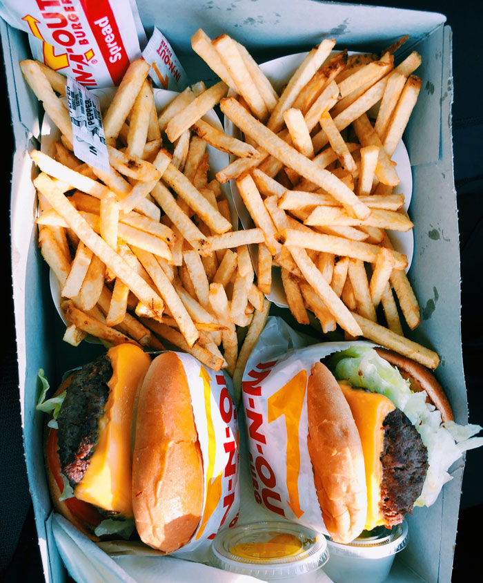 French fries and two burgers 