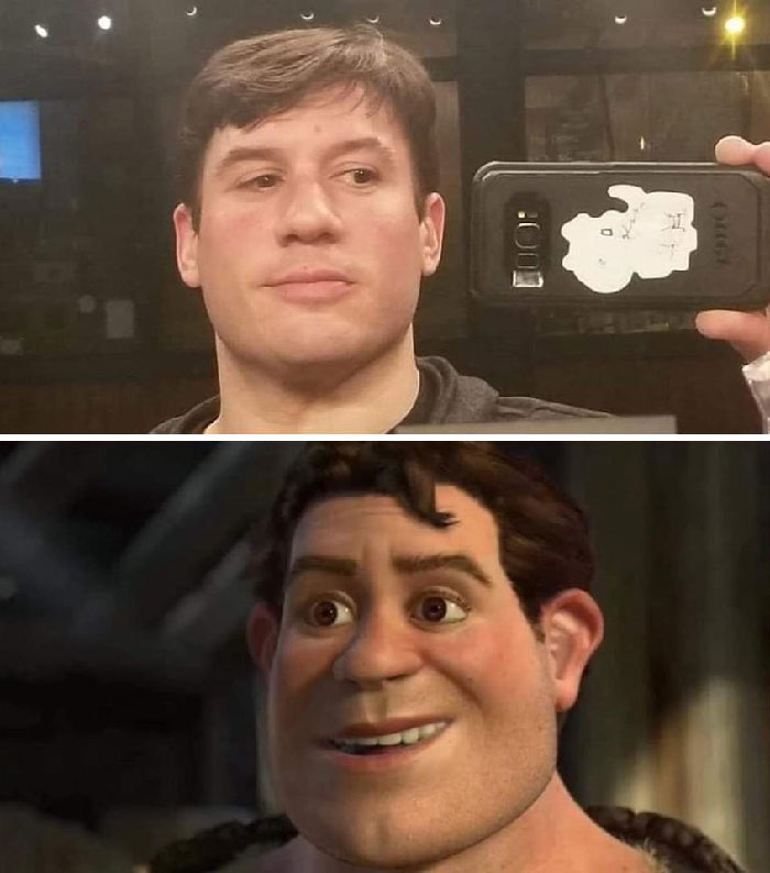 Human Shrek and the same looking man taking a picture in front of the mirror 