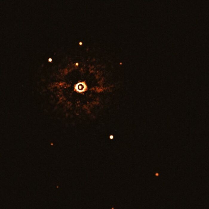 First Direct Image Of Another Planetary System Located About 300 Light-Years Away Around A Star Like Our Sun