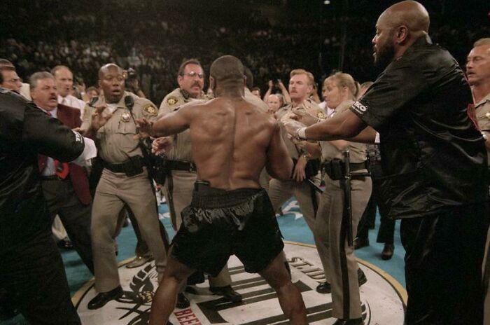 Las Vegas Police Officers Try And Restrain An Angry Mike Tyson Who Just Bit Off A Chunk Of His Opponents Ear