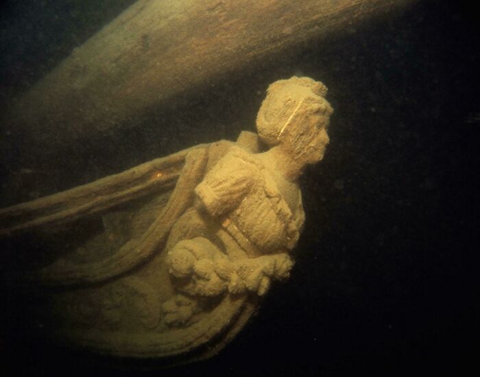 Diana, The Figurehead Of The Uss Hamilton In The Murky Waters Of Lake Ontario