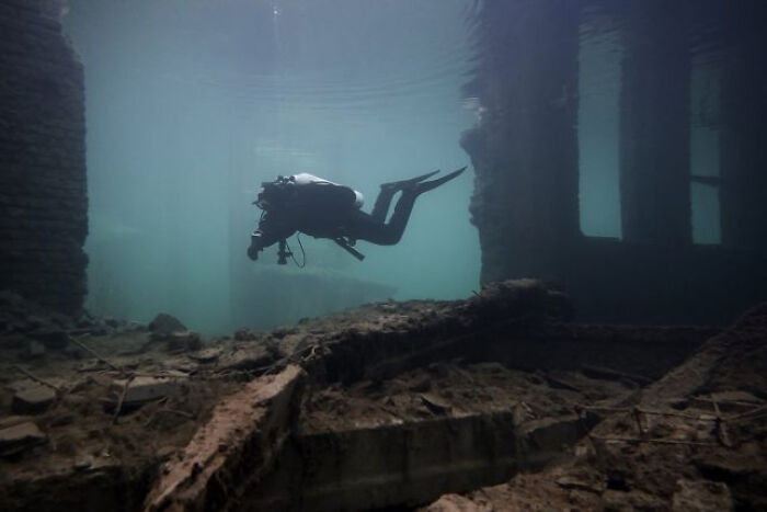 Diver Exploring Flooded Soviet Prison Camp