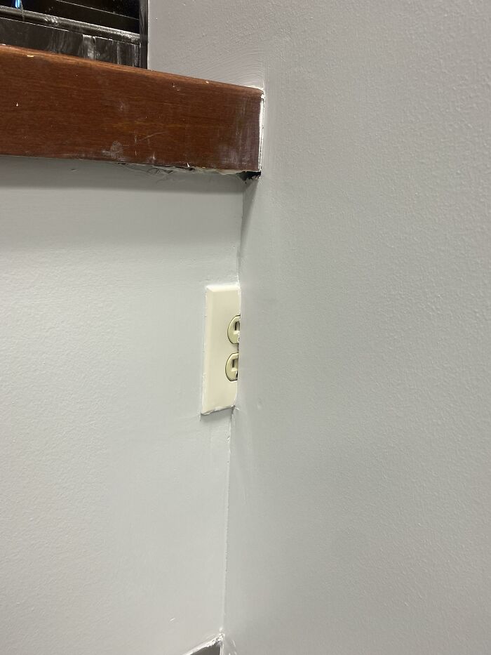 Our Office Was Renovated. They Were Too Lazy To Move The Outlet Location Or The Wall Over