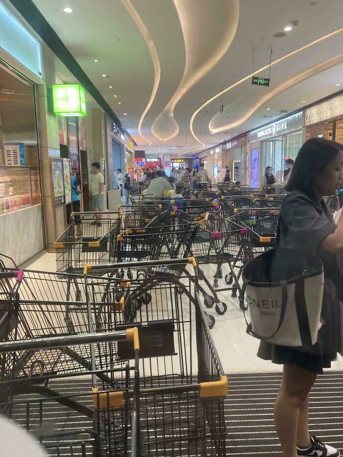 Lazy Shoppers Leaving Their Carts, Blocking The Entrance To The Mall