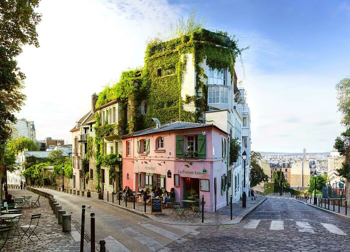 La Maison Rose, Paris. This Tiny Pink House Built On The Slopey Junction Some Time Before 1850 That Now Rests Against An Art-Deco Building Of The 30s Has Become One Of The Most Iconic Places In Montmartre