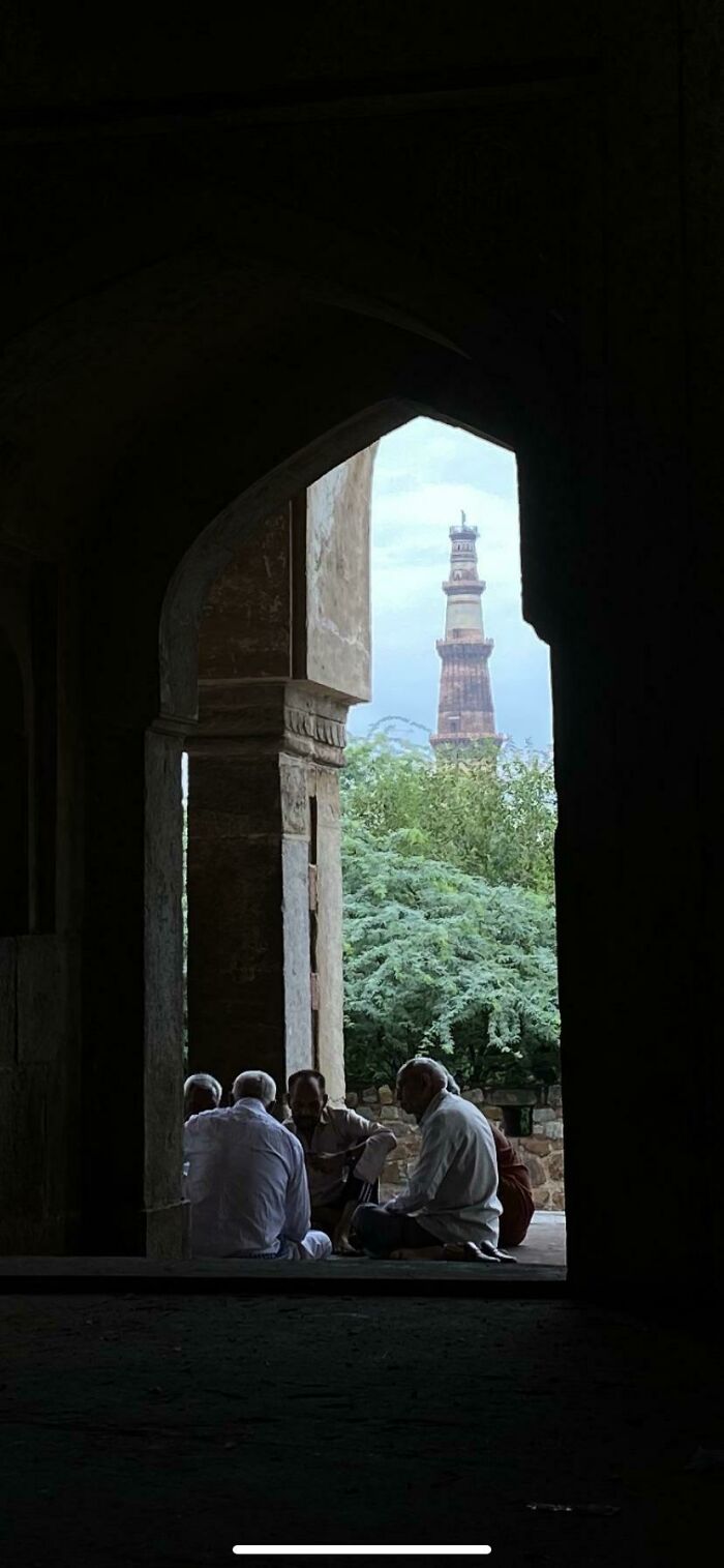 A Card Game (Qutub Minar Seen From Bhool Bhulaia)